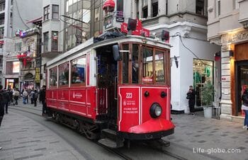 Red retro tram in Istanbul along street Istiklal "Nostalgia"(Taksim-Tünel Nostalgia Tramway)